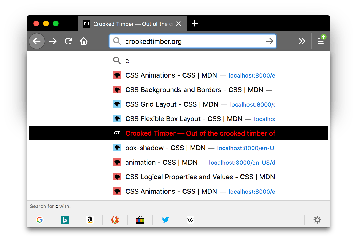 Browser Firefox ist schwarz. Die Tabs und die URL-Leiste des Browsers sind hellgrau mit Symbolen und Text in Weiß. Ein Suchergebnisse-Popup wird angezeigt, wobei der Text eines markierten Elements rot ist mit einem schwarzen Hintergrund. Die Textfarbe des markierten Elements kontrastiert gut mit der schwarzen Hintergrundfarbe dieses Elements.